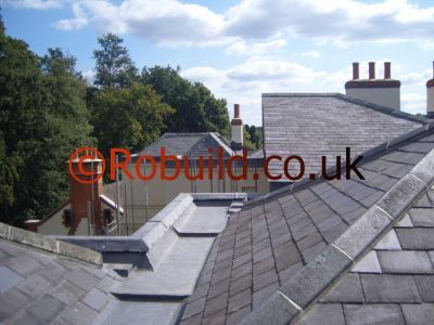 roofer working on a natural slate roof